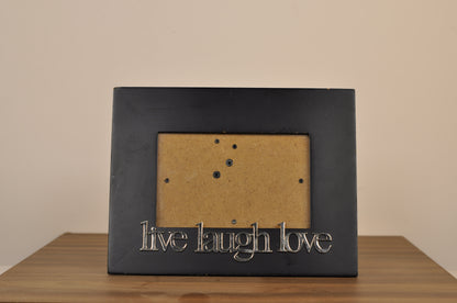 Cuadro decorativo de pared color negro con la frase